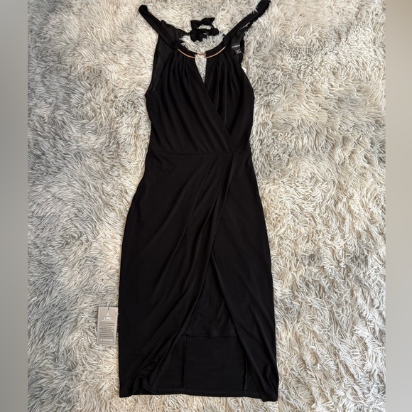 le chateau Dresses & Skirts - NWT Le Chateau Black Halter Wrap Dress